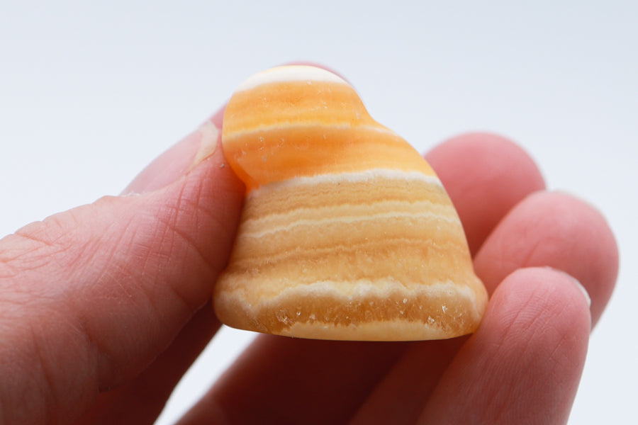 Orange Calcite Santa Hat Carving